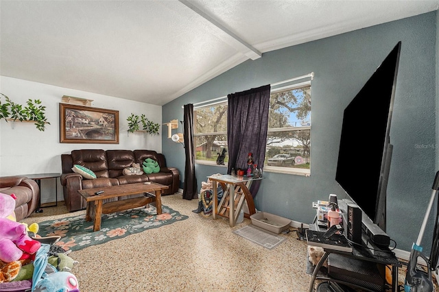 living room featuring vaulted ceiling with beams, a textured ceiling, and speckled floor