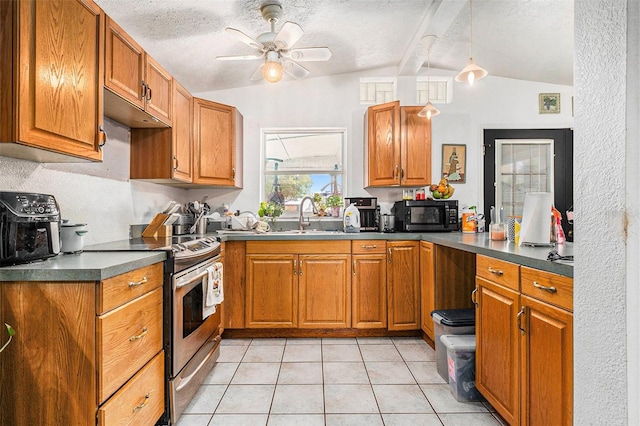 kitchen with black microwave, a textured ceiling, stainless steel electric range, brown cabinetry, and dark countertops