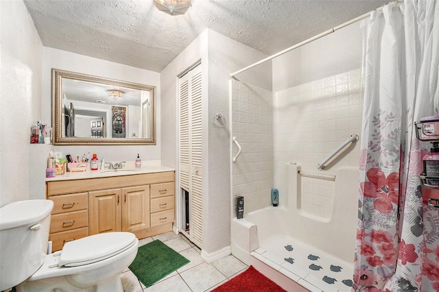 full bathroom featuring curtained shower, toilet, vanity, a textured ceiling, and tile patterned floors