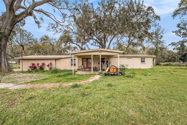 view of front of home with a patio area and a front lawn