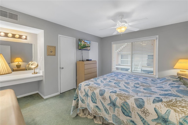 bedroom featuring baseboards, visible vents, and a ceiling fan