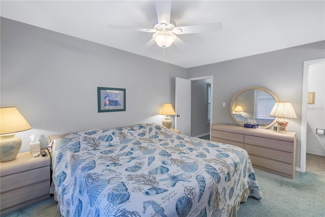 bedroom featuring light carpet, ceiling fan, and baseboards