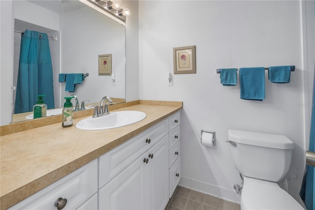 full bath featuring toilet, tile patterned flooring, baseboards, and vanity