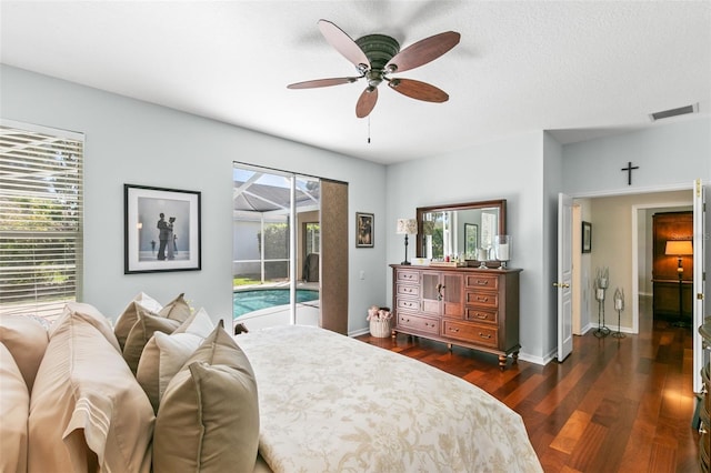 bedroom featuring access to exterior, ceiling fan, baseboards, and dark wood-type flooring