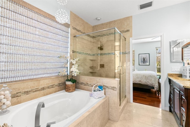 ensuite bathroom with a garden tub, visible vents, a stall shower, connected bathroom, and vanity