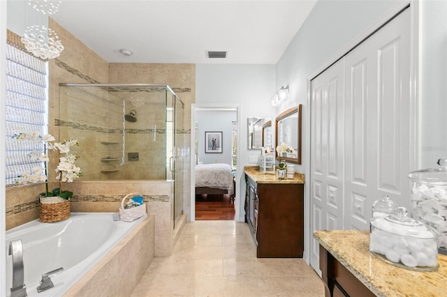 bathroom featuring a stall shower, tile patterned flooring, a garden tub, and visible vents