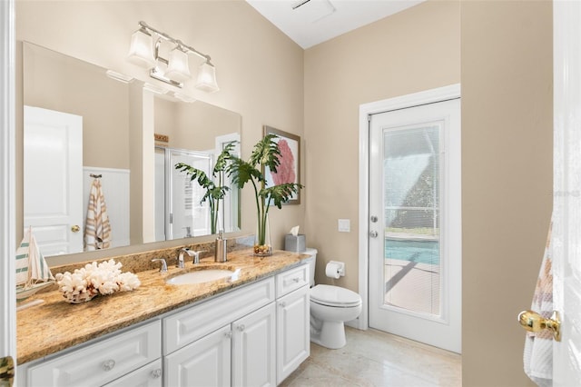 full bathroom with vanity, toilet, and tile patterned floors