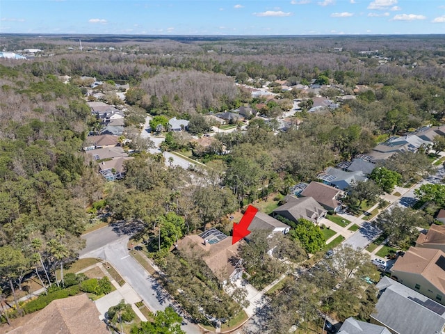 aerial view featuring a residential view and a view of trees