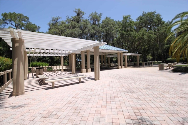 view of community featuring a patio and a pergola