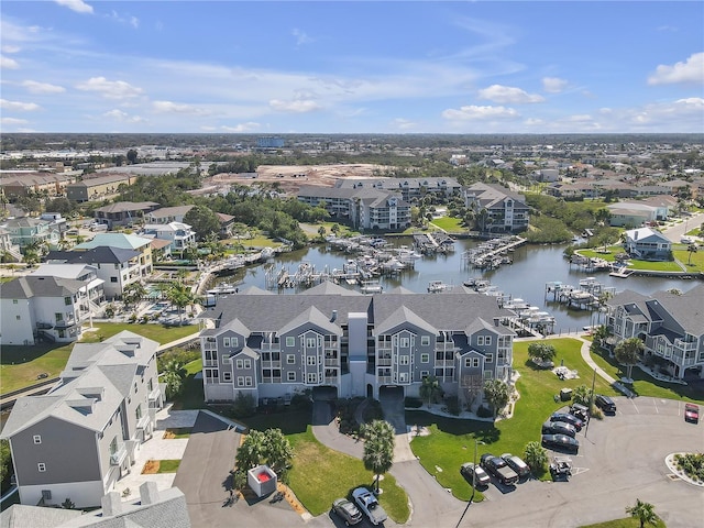 birds eye view of property with a water view and a residential view