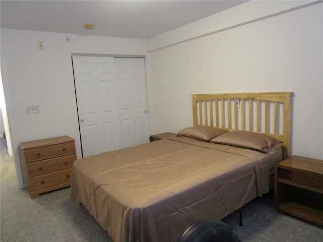 carpeted bedroom with a closet