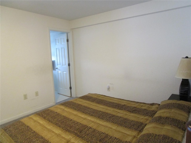 bedroom with wood finished floors