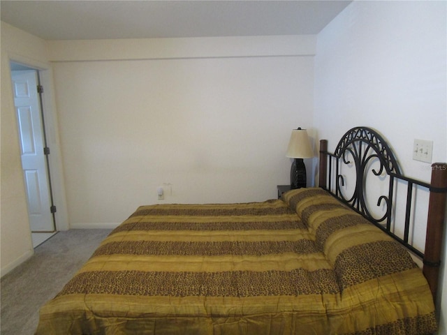 carpeted bedroom with baseboards