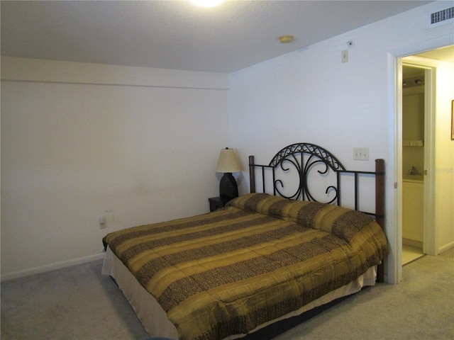 bedroom with carpet, visible vents, and baseboards