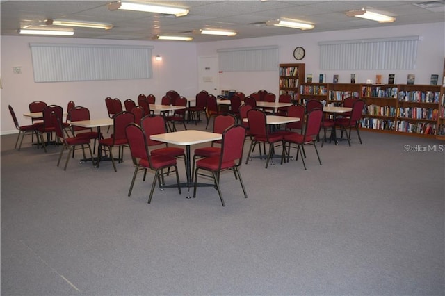 dining space featuring a paneled ceiling