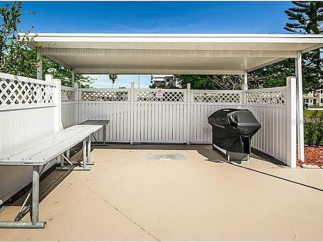 view of patio featuring grilling area and fence