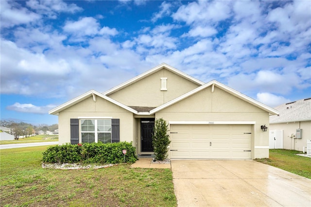 single story home with a garage, concrete driveway, a front lawn, and stucco siding