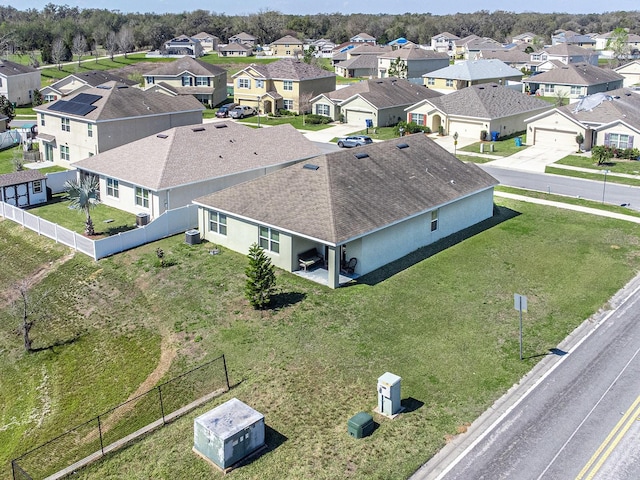 birds eye view of property with a residential view
