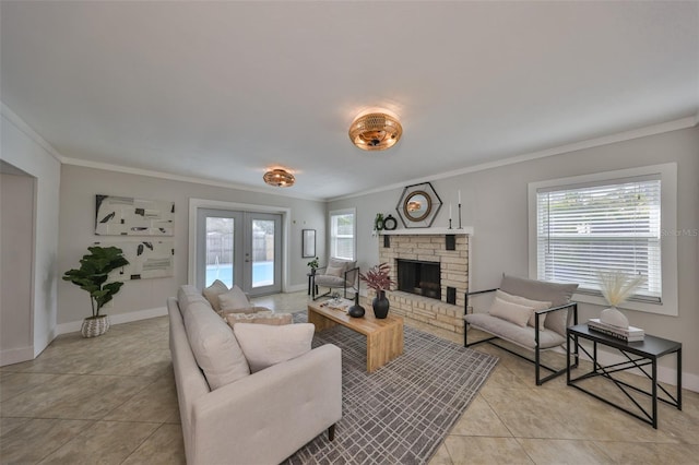 living room featuring french doors, crown molding, a fireplace, light tile patterned flooring, and baseboards