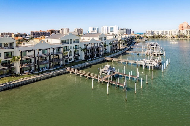 view of dock featuring a water view and a city view