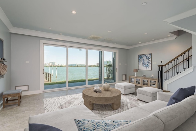 living area featuring recessed lighting, a water view, ornamental molding, baseboards, and stairs