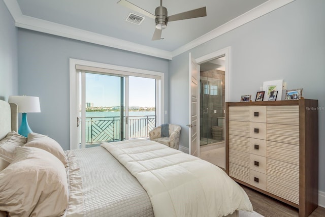 bedroom featuring visible vents, wood finished floors, a water view, access to outside, and crown molding