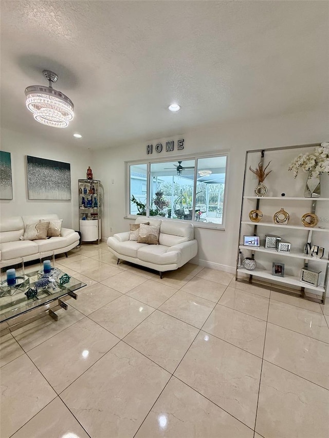 unfurnished living room featuring baseboards, a textured ceiling, and light tile patterned flooring