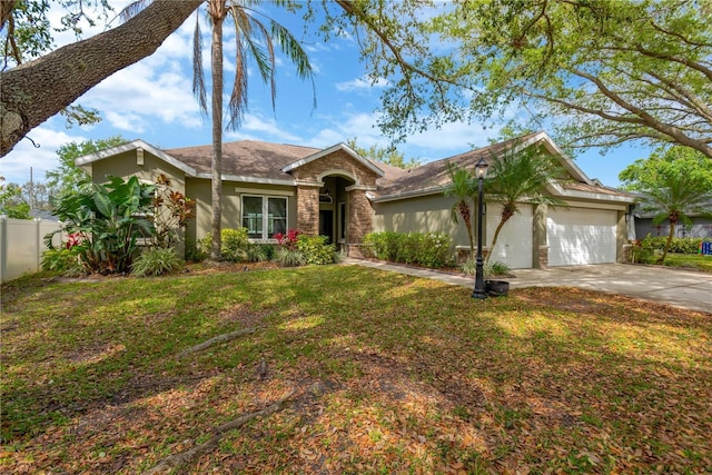 single story home with fence, driveway, an attached garage, stucco siding, and a front lawn