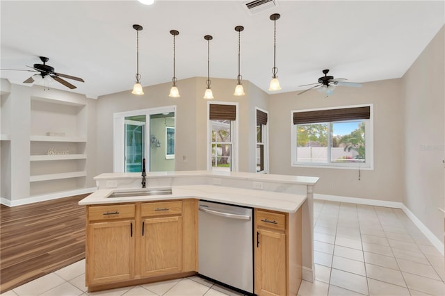 kitchen with visible vents, ceiling fan, a sink, stainless steel dishwasher, and open floor plan