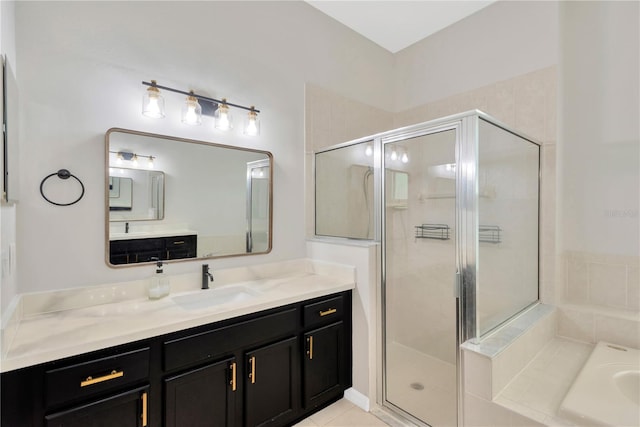 bathroom featuring vanity, a shower stall, and a garden tub