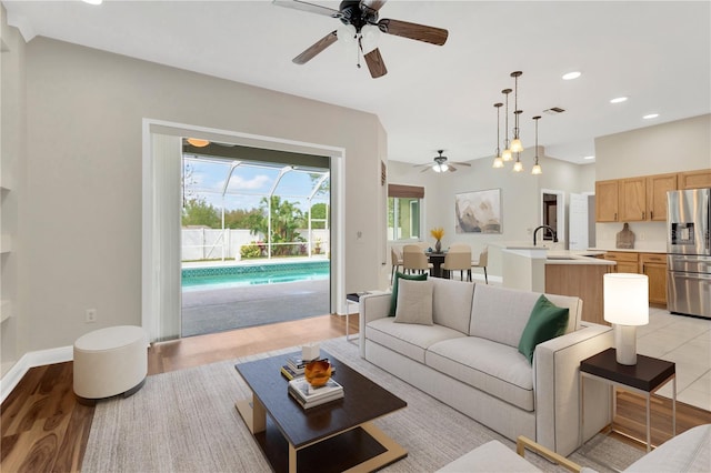 1166 Lumsden Trace Cir, Valrico, FL 33594 - living area with ceiling fan, recessed lighting, and light wood-style flooring