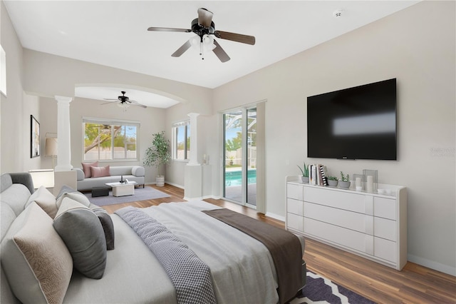 1166 Lumsden Trace Cir, Valrico, FL 33594 - bedroom featuring decorative columns, access to outside, light wood-style flooring, and ceiling fan