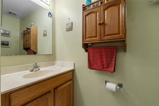 bathroom with visible vents and vanity