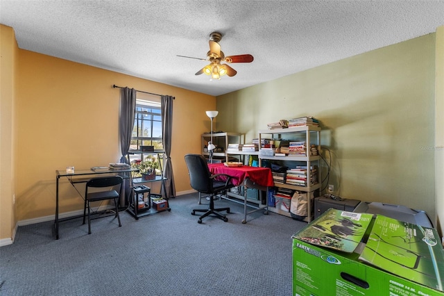 office space featuring carpet floors, ceiling fan, a textured ceiling, and baseboards