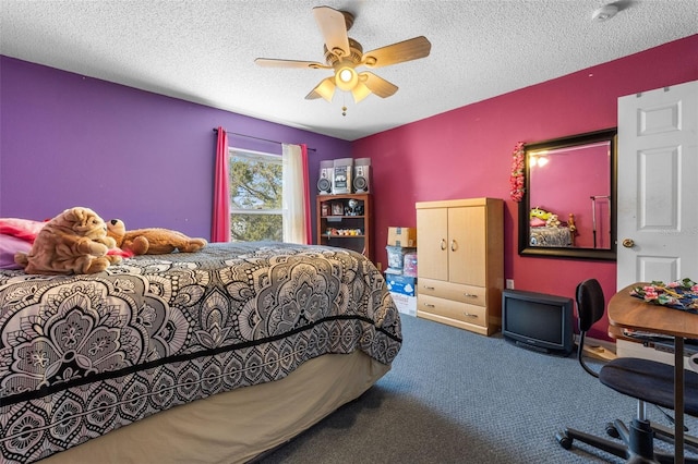 carpeted bedroom with ceiling fan and a textured ceiling