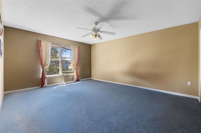 unfurnished room with a ceiling fan, carpet flooring, a textured ceiling, and baseboards