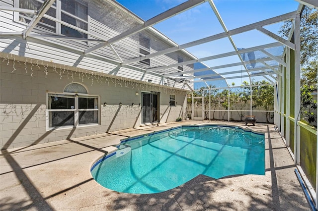 view of pool featuring a patio area, a lanai, and a fenced in pool