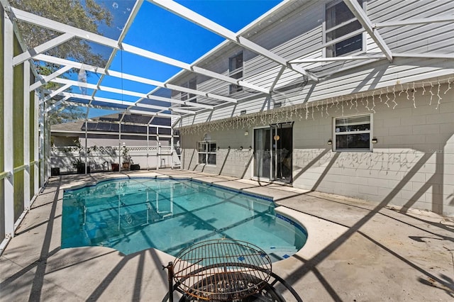 view of pool featuring a patio, a lanai, and a fenced in pool