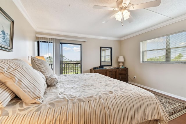 bedroom with access to exterior, crown molding, a textured ceiling, wood finished floors, and baseboards