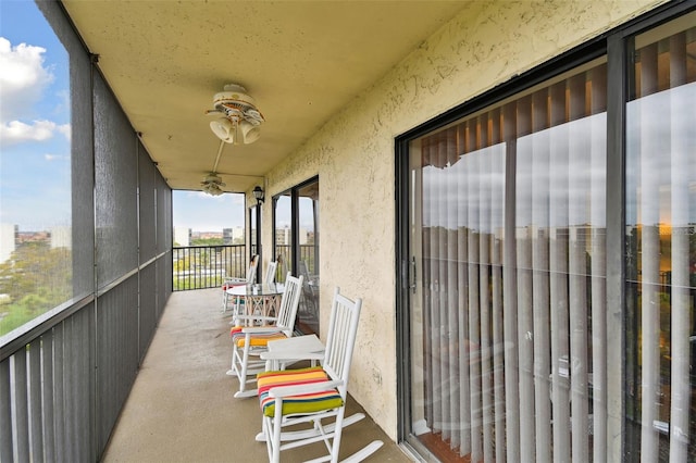 balcony featuring a ceiling fan