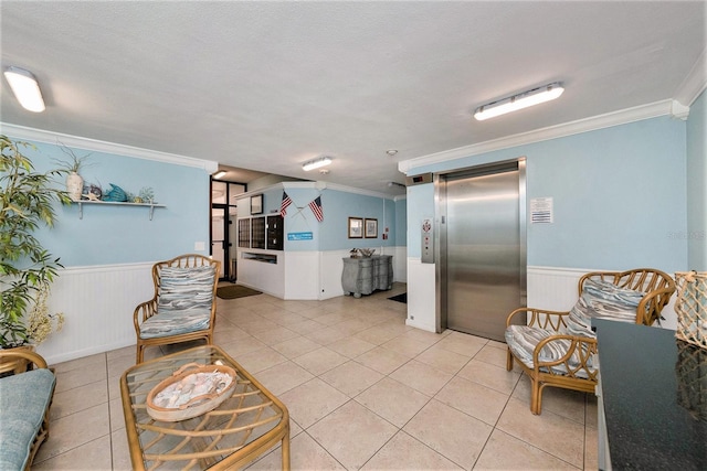 interior space featuring elevator, a wainscoted wall, crown molding, and light tile patterned flooring