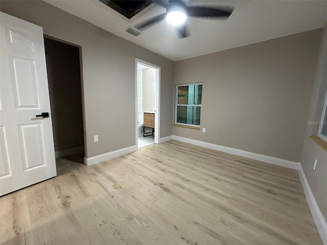 unfurnished bedroom with ceiling fan, light wood finished floors, visible vents, and baseboards