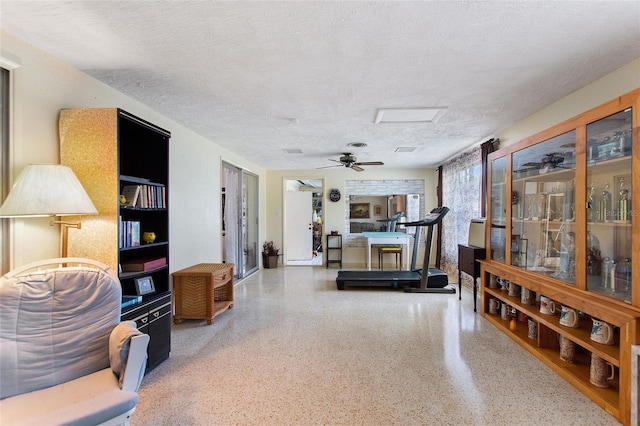 4310 Indian Lake Dr, Indian Lake Estates, FL 33855 - interior space with attic access, a ceiling fan, a textured ceiling, and speckled floor