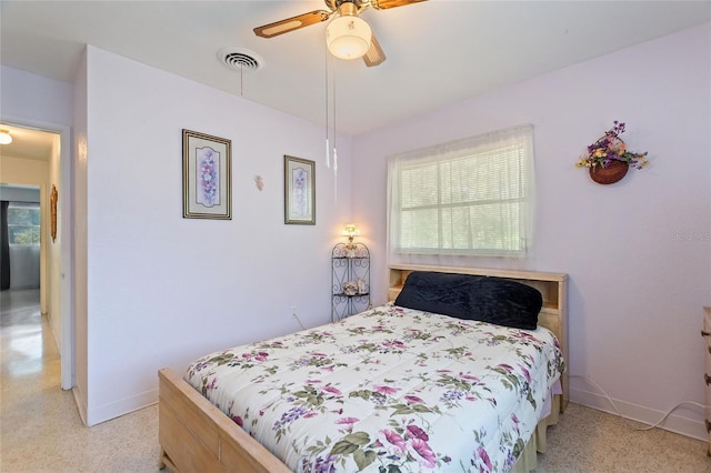 4310 Indian Lake Dr, Indian Lake Estates, FL 33855 - bedroom with a ceiling fan, visible vents, baseboards, and multiple windows