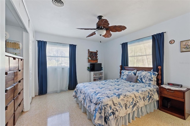 4310 Indian Lake Dr, Indian Lake Estates, FL 33855 - bedroom featuring multiple windows, visible vents, a ceiling fan, and speckled floor
