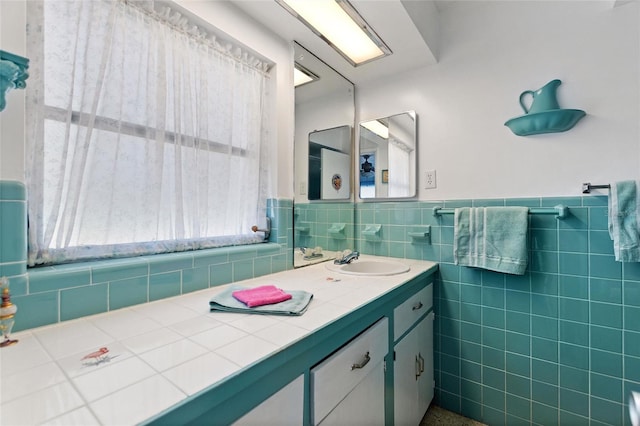 4310 Indian Lake Dr, Indian Lake Estates, FL 33855 - bathroom featuring wainscoting, vanity, and tile walls