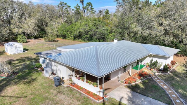 4310 Indian Lake Dr, Indian Lake Estates, FL 33855 - birds eye view of property with a wooded view