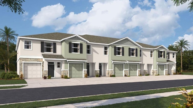 view of front of house with a garage, stone siding, driveway, and stucco siding