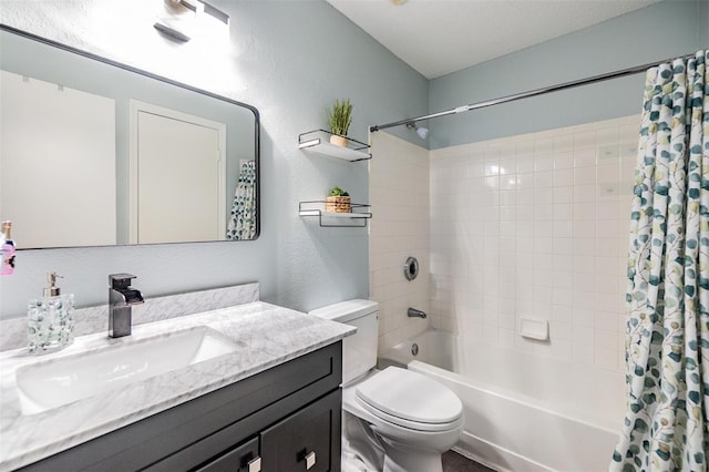 full bathroom with toilet, shower / tub combo, a textured wall, and vanity