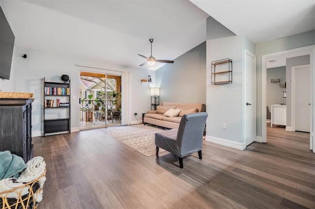 living room with lofted ceiling, ceiling fan, baseboards, and wood finished floors